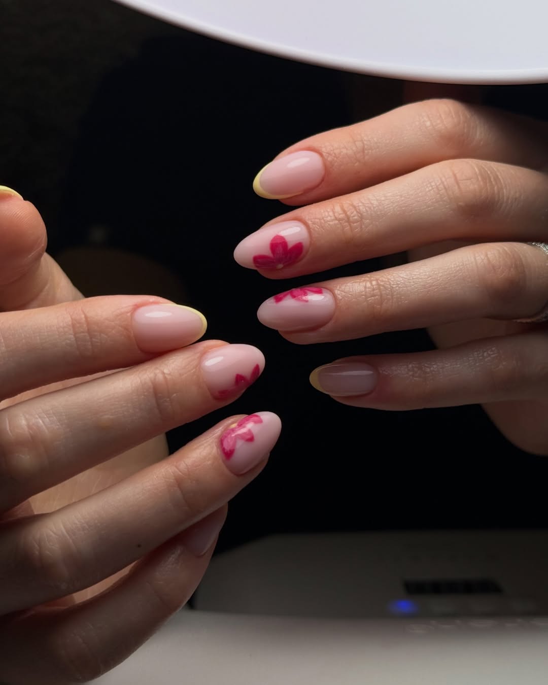 Nail art — delicate pink floral manicure on both hands